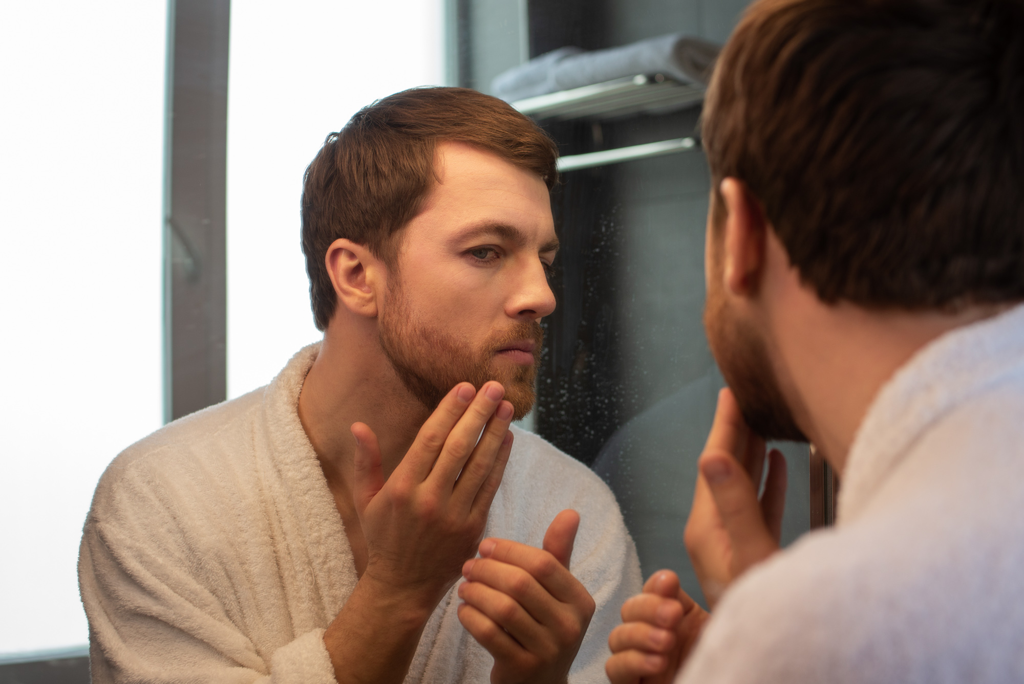 A patient works to maintain his skin health after a resurfacing laser treatment in NYC